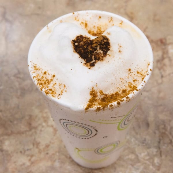 Close-up of a Charley's Deli and Grille coffee with a heart design in the foam.